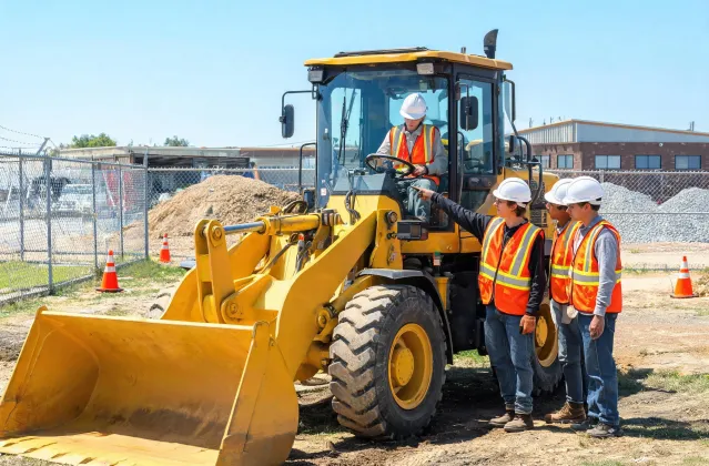 Community college students training on donated wheel loader